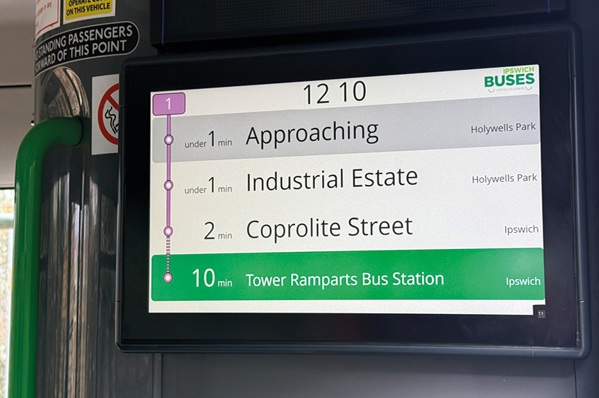 A close-up image of a PSVAIR-compliant display on a bus showing destination, next-stop and intermediate calling points.