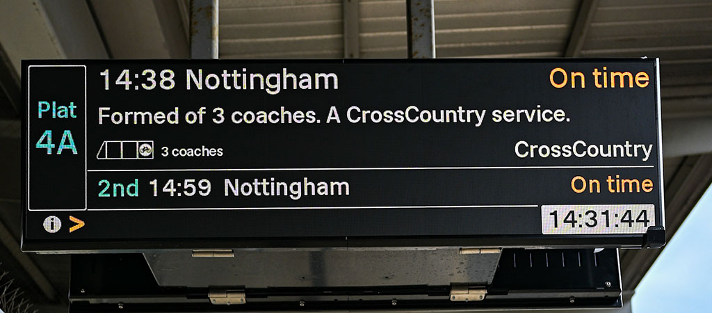 The image shows the latest fine pitch RGB LED customer information display on a rail platform. 