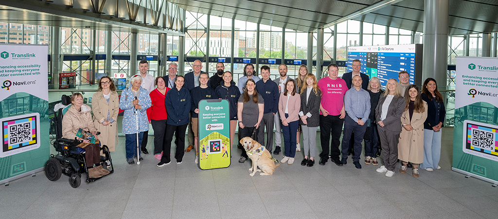 The image shows the group of people responsible for the design, review and implementation of NaviLens at Belfast Grand Central Station