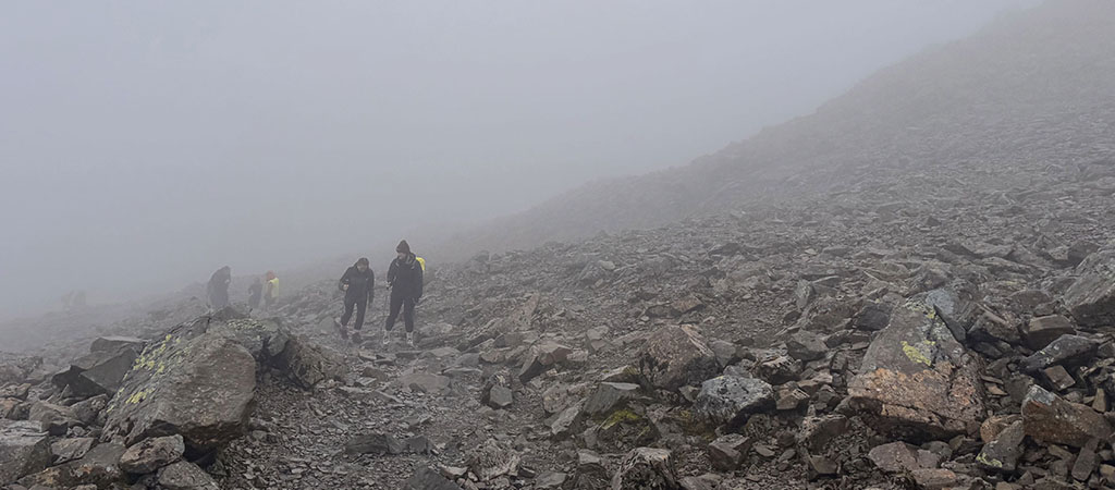 An image from the challenge showing participants ascending a peak